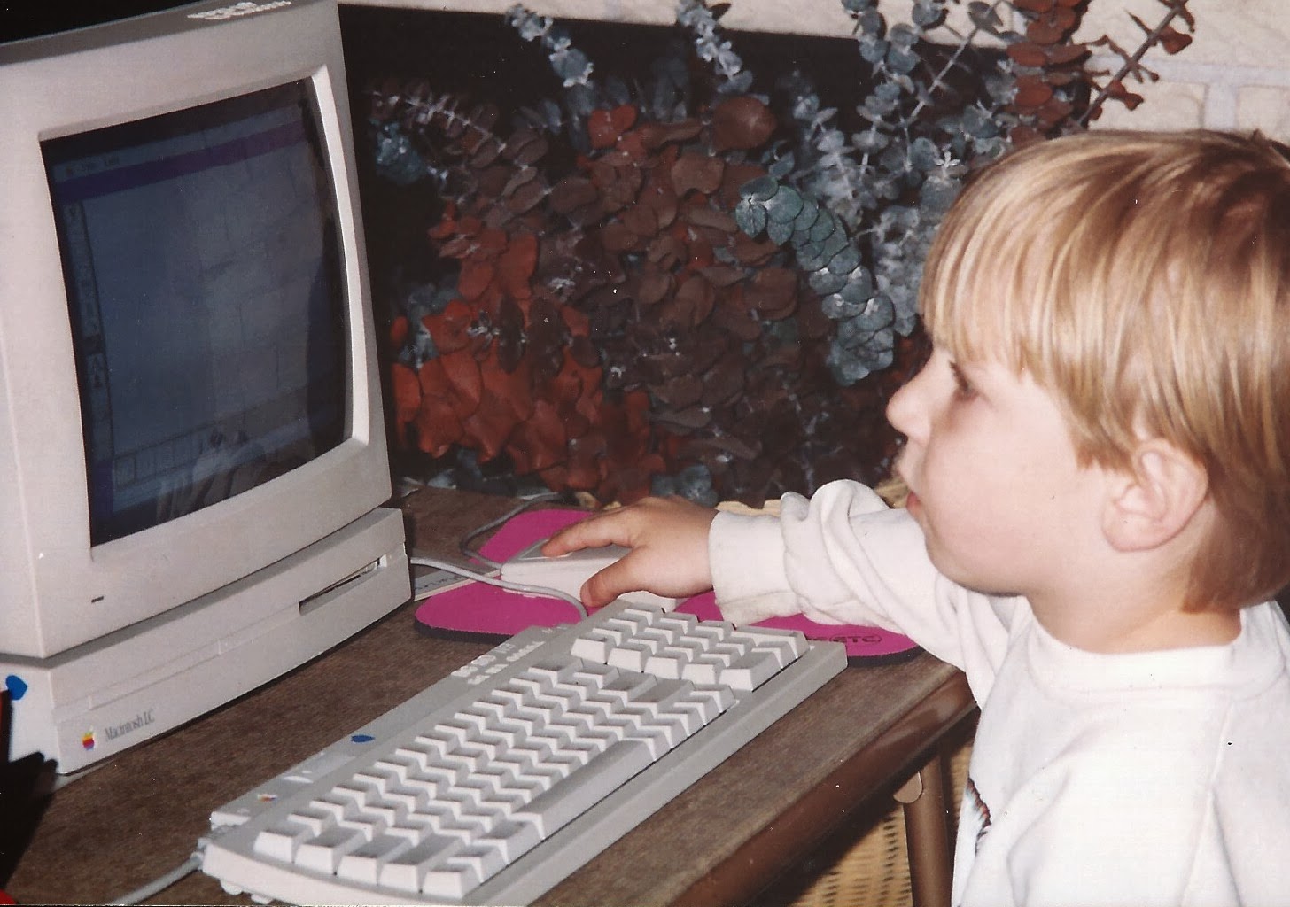 Young me using a Macintosh LC